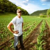 man standing on garden during daytime